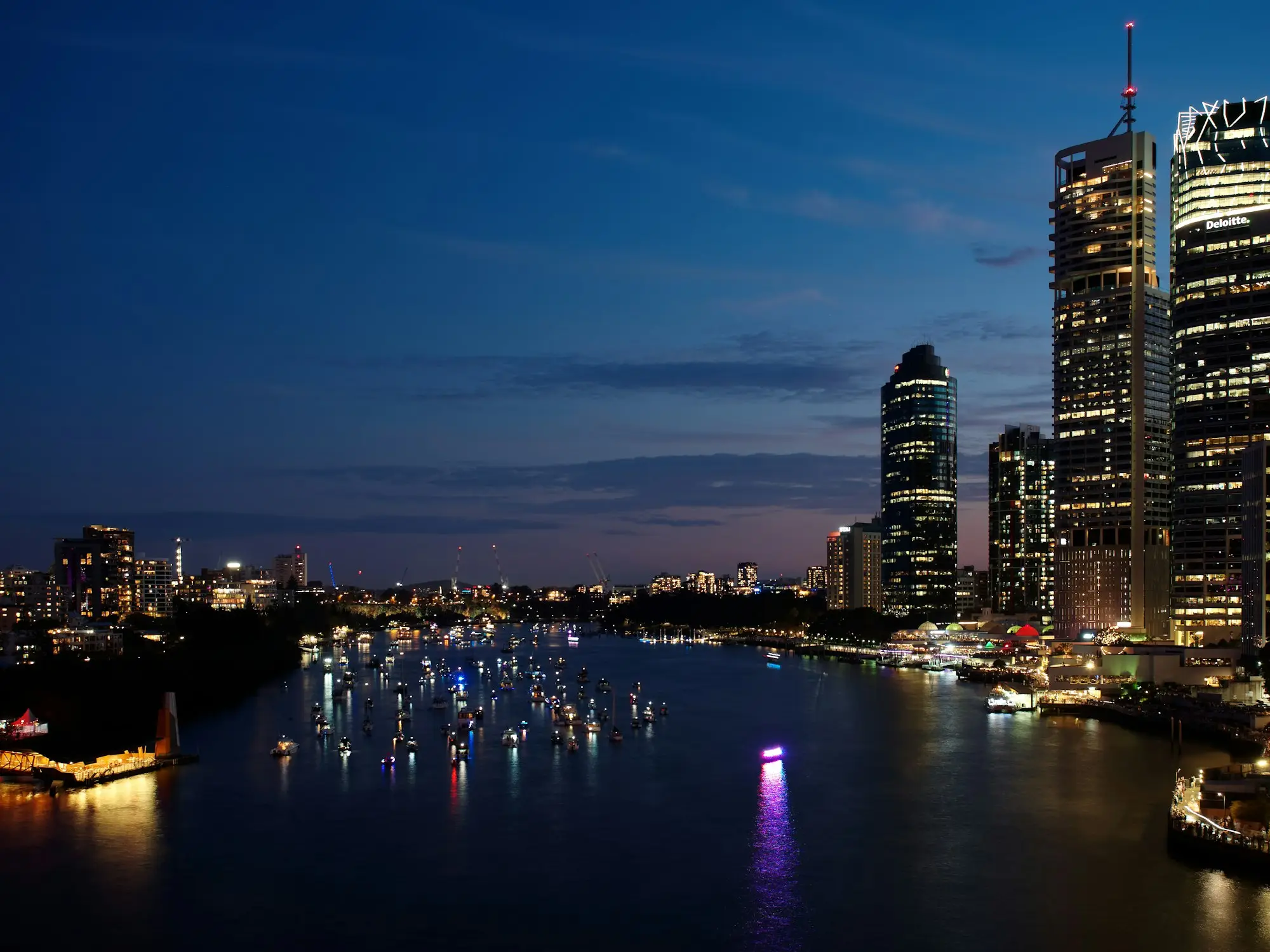 Brisbane city lit up at night across the river