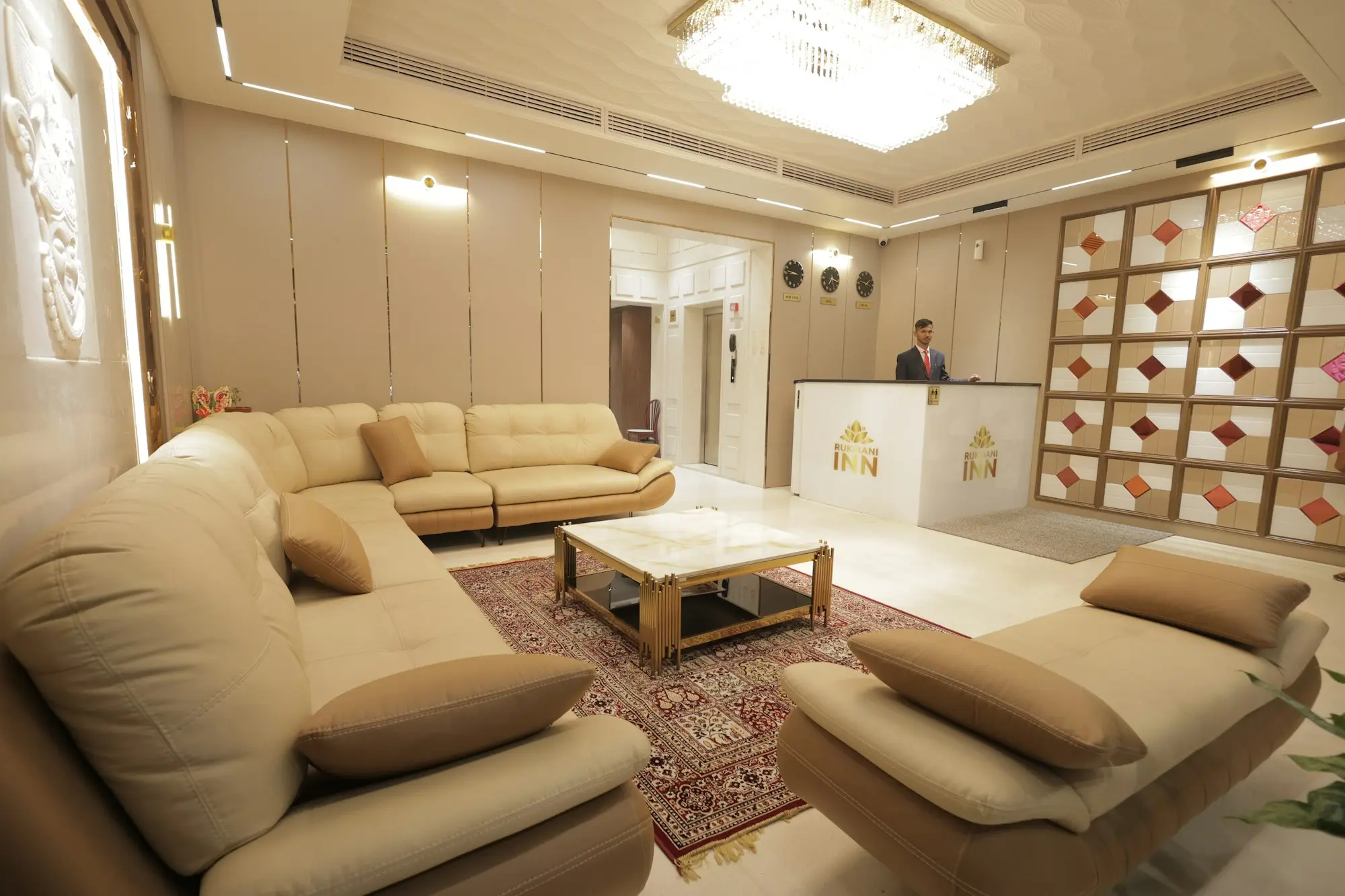 Hotel lobby with a reception desk and seating
