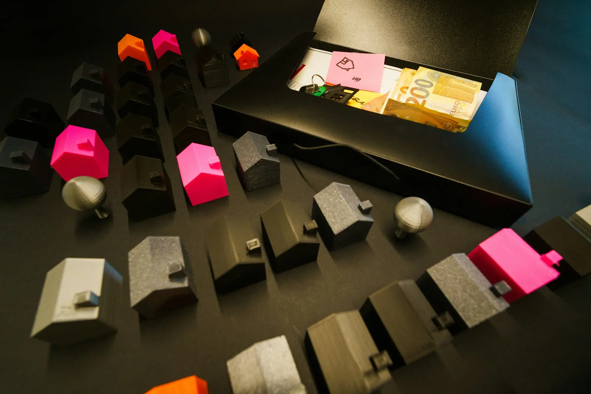 Miniature houses arranged in a box