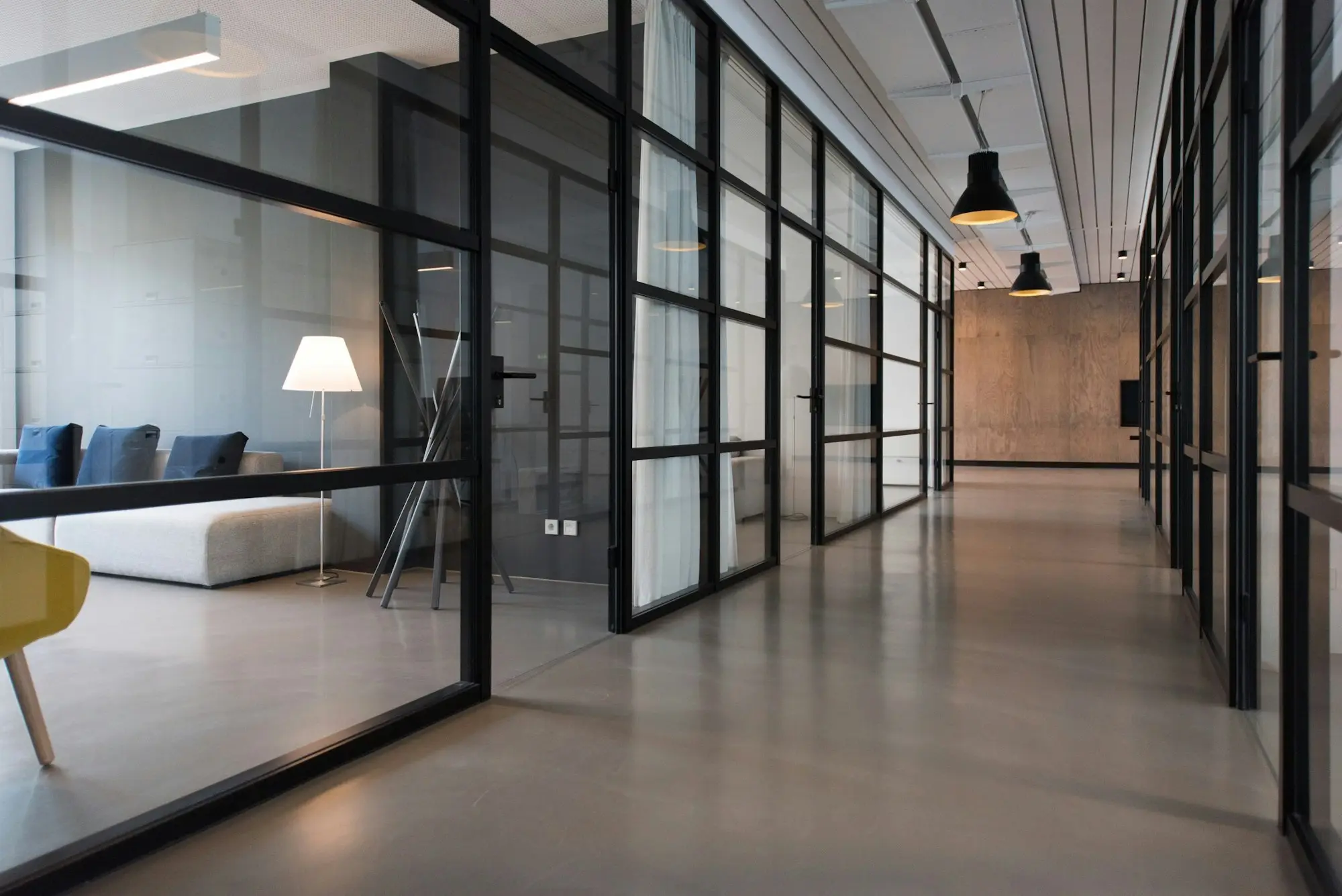 Office hallway between glass-panel doors