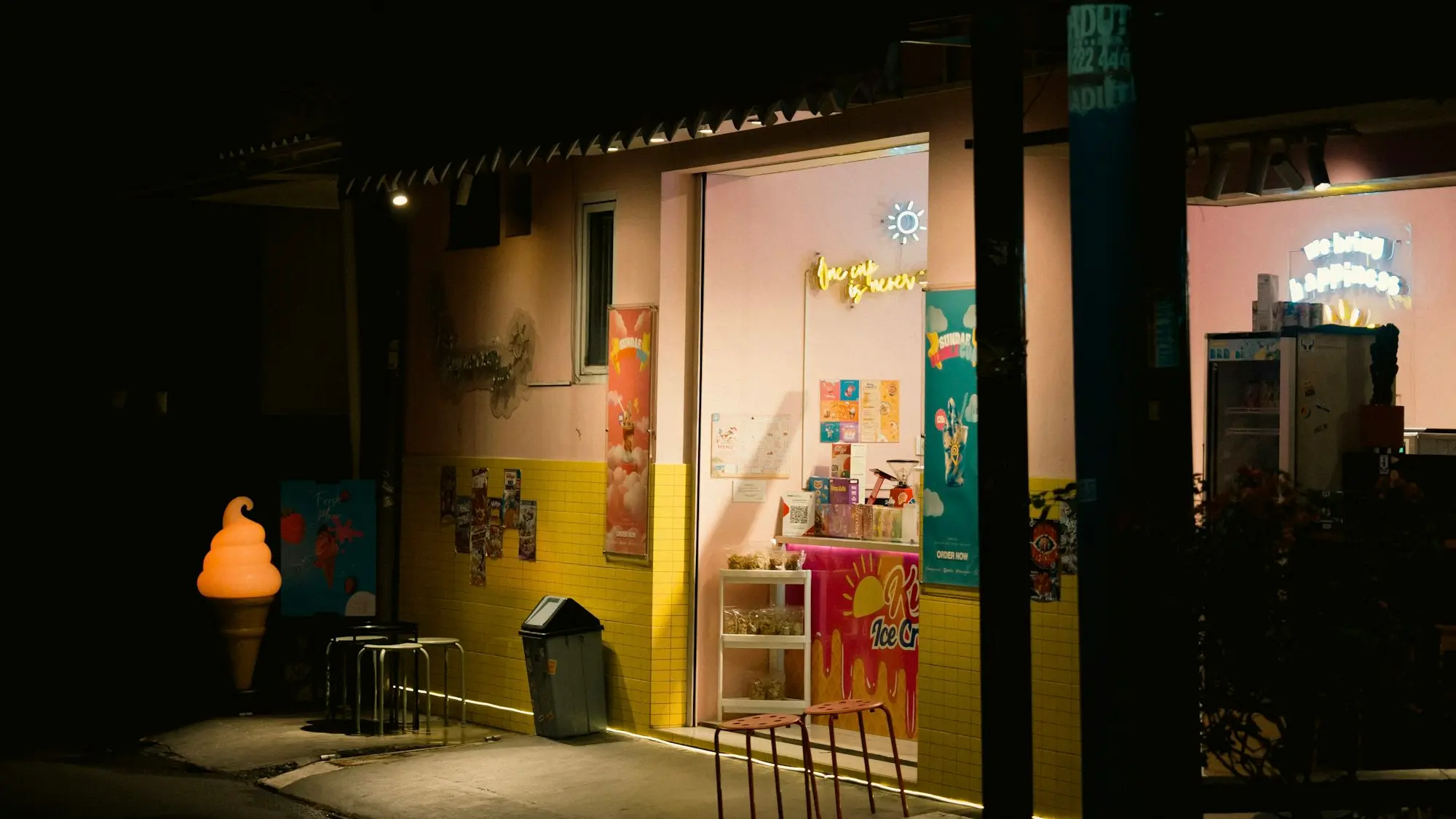 A brightly lit shop window at night
