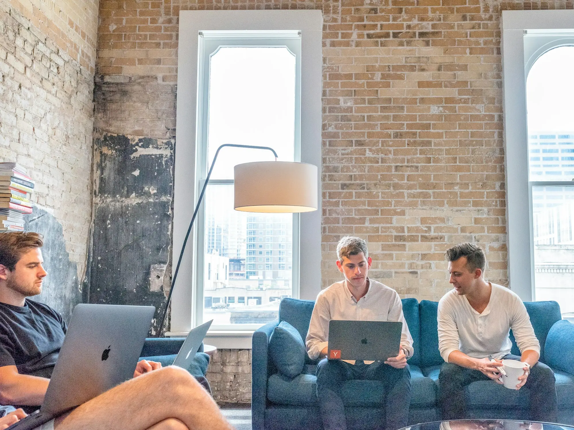 Three founders working on laptops