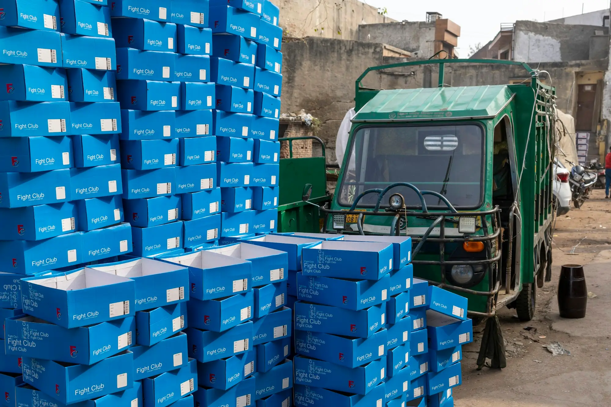 Truck parked beside a pile of boxes