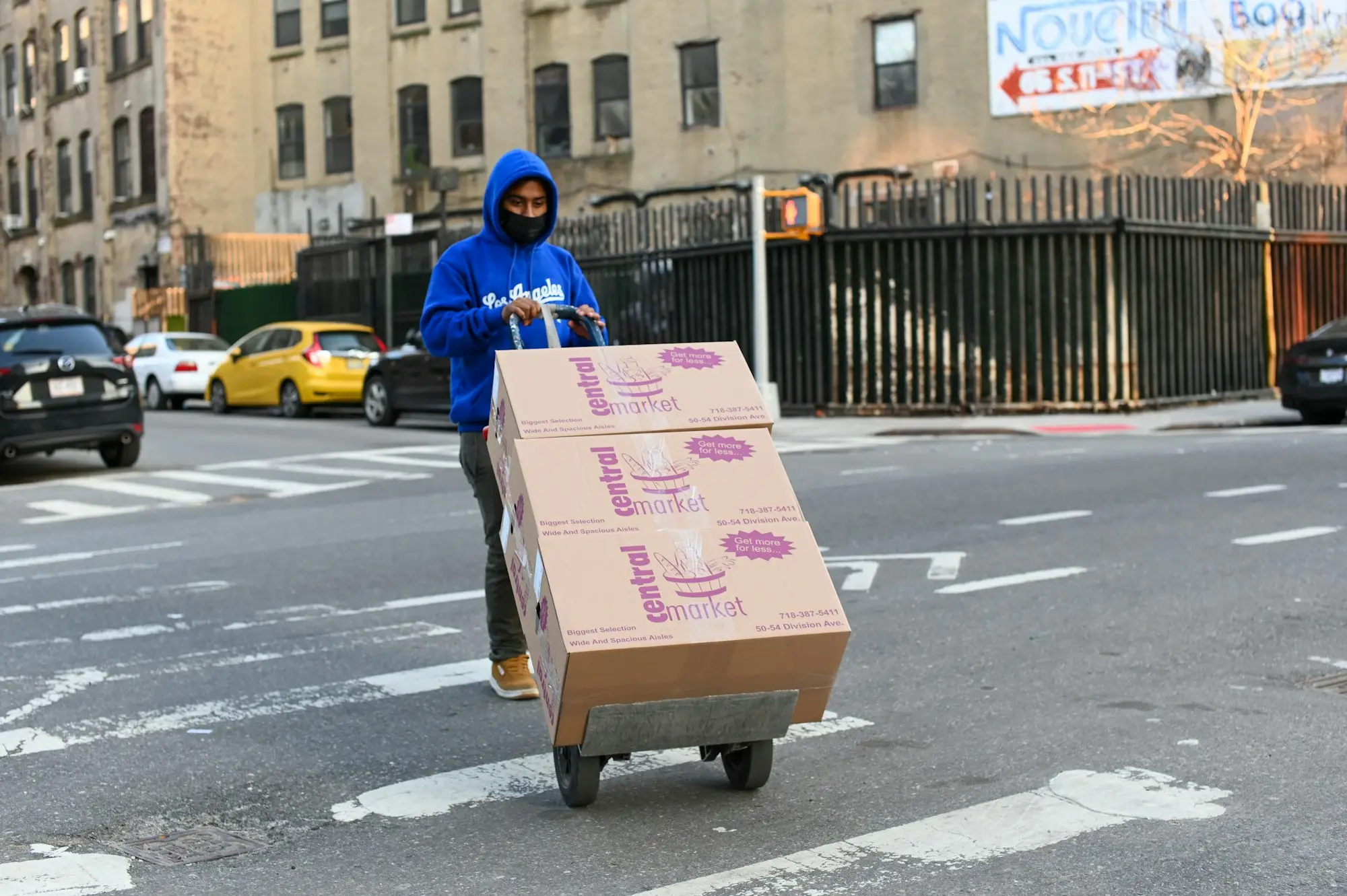 Worker carrying a cardboard box